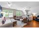 Bright, loft bedroom with seating area, large windows, and a comfortable king-sized bed at 654 Cannon Rd, Sharpsburg, GA 30277