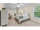 Bright bedroom with neutral tones, features a metal frame bed and ample natural light at 654 Cannon Rd, Sharpsburg, GA 30277