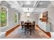 Formal dining room featuring coffered ceilings, large windows, and a dining set for memorable gatherings at 654 Cannon Rd, Sharpsburg, GA 30277