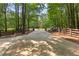 Gated driveway leading to home amid lush greenery and mature trees, creating a private, wooded setting at 654 Cannon Rd, Sharpsburg, GA 30277