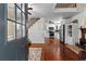 Welcoming entryway leading into the kitchen with hardwood floors and classic white trim at 654 Cannon Rd, Sharpsburg, GA 30277