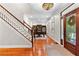 Spacious foyer features a staircase and home office with built-in bookshelves, bathed in natural light at 654 Cannon Rd, Sharpsburg, GA 30277