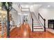 Spacious foyer with grand staircase, high ceilings, and gleaming hardwood floors, creating an elegant entrance at 654 Cannon Rd, Sharpsburg, GA 30277