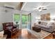 Bright living room featuring hardwood floors, comfortable seating, and natural light, creating a cozy atmosphere at 654 Cannon Rd, Sharpsburg, GA 30277
