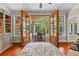 Cozy living room with wooden floors and double doors opening to a covered deck at 654 Cannon Rd, Sharpsburg, GA 30277