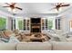 Cozy living room featuring built-in bookshelves, fireplace, and comfortable seating at 654 Cannon Rd, Sharpsburg, GA 30277