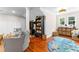 Bright playroom with hardwood floors, play area and a cozy seating area at 654 Cannon Rd, Sharpsburg, GA 30277