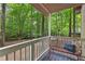 Cozy porch with a bench, creating a peaceful spot to enjoy the surrounding nature at 654 Cannon Rd, Sharpsburg, GA 30277