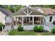 Back exterior view of home with a covered porch, outdoor seating, and a grill offers an ideal entertaining space at 654 Cannon Rd, Sharpsburg, GA 30277