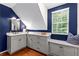 Wet bar featuring grey cabinetry, granite countertops, and a window seat at 654 Cannon Rd, Sharpsburg, GA 30277