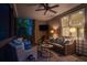 Screened-in porch with seating and view of wooded area at 1315 Woodland Trce, Cumming, GA 30041