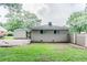 A spacious backyard features a stone patio, carport, and lush greenery at 1982 Yucca Dr, Decatur, GA 30032