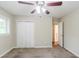 Spacious bedroom with a closet and doorway that leads to a bathroom and ceiling fan at 1982 Yucca Dr, Decatur, GA 30032