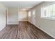 Well-lit empty room with hardwood floors, neutral walls, and natural light at 1982 Yucca Dr, Decatur, GA 30032