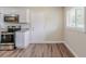 Well-lit kitchen with stainless steel appliances, white cabinets, and granite countertops at 1982 Yucca Dr, Decatur, GA 30032