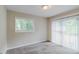 Bright room features a sliding glass door leading to patio, and neutral colored carpet at 1982 Yucca Dr, Decatur, GA 30032