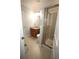Well-lit bathroom with tiled shower, granite countertop, and neutral color scheme at 2311 Arnold Palmer Way, Duluth, GA 30096