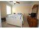 Bright bedroom with natural light and a decorative dresser at 2311 Arnold Palmer Way, Duluth, GA 30096