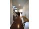 Inviting foyer features hardwood floors, staircase, and decoratively furnished console table at 2311 Arnold Palmer Way, Duluth, GA 30096