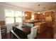 Bright kitchen with granite counters, stainless appliances and dining table at 2311 Arnold Palmer Way, Duluth, GA 30096