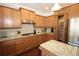 Kitchen with granite counters, gas cooktop and stainless appliances at 2311 Arnold Palmer Way, Duluth, GA 30096
