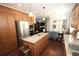Spacious kitchen featuring an island, stainless appliances and adjacent dining area at 2311 Arnold Palmer Way, Duluth, GA 30096