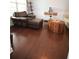 Stylish living room with hardwood floors, leather chair, and decorative accents at 2311 Arnold Palmer Way, Duluth, GA 30096