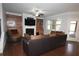 Inviting living room with hardwood floors, built-in shelves, fireplace, and comfortable seating at 2311 Arnold Palmer Way, Duluth, GA 30096