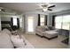 Spacious sitting room with a fireplace, backyard access and sitting area at 2311 Arnold Palmer Way, Duluth, GA 30096