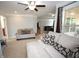 Bright sitting room featuring comfortable couches, decorative pillows and large windows at 2311 Arnold Palmer Way, Duluth, GA 30096