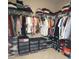 Spacious walk-in closet featuring ample storage for clothing and accessories at 2311 Arnold Palmer Way, Duluth, GA 30096