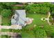 Aerial view of the property featuring a lush, landscaped backyard with a patio and gazebo at 2430 Flat Stone Dr, Cumming, GA 30041
