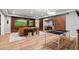 Finished basement boasts a large flatscreen television, ping pong table, and sliding barn doors at 2430 Flat Stone Dr, Cumming, GA 30041