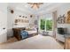 Cozy bedroom with a daybed, soft carpet, and a large window with natural light at 2430 Flat Stone Dr, Cumming, GA 30041