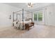 Elegant bedroom with four poster bed, neutral color scheme, and natural light at 2430 Flat Stone Dr, Cumming, GA 30041