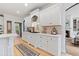 Bright kitchen with white cabinetry, marble countertops, and stainless steel appliances at 2430 Flat Stone Dr, Cumming, GA 30041