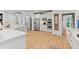 Spacious kitchen featuring stainless steel appliances, custom cabinets, and hardwood flooring at 2430 Flat Stone Dr, Cumming, GA 30041