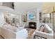 Spacious living room with fireplace, built-in shelving, and abundant natural light at 2430 Flat Stone Dr, Cumming, GA 30041
