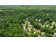 Aerial view of the neighborhood with mature trees surrounding homes and properties at 4818 Terrace Green Trce, Stone Mountain, GA 30088
