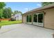 Concrete patio with access to the green backyard at 4818 Terrace Green Trce, Stone Mountain, GA 30088