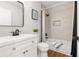 A full bathroom with tub and shower combo featuring modern fixtures and classic white vanity at 4818 Terrace Green Trce, Stone Mountain, GA 30088