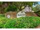 Community sign for Shadowmoss at Highgate with decorative stone and lush foliage at 4818 Terrace Green Trce, Stone Mountain, GA 30088