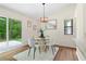 Dining Area boasts ample light with a sliding glass door leading to a patio and backyard views at 4818 Terrace Green Trce, Stone Mountain, GA 30088