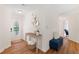 Bright foyer featuring wood floors, a decorative mirror, and a charming entryway table at 4818 Terrace Green Trce, Stone Mountain, GA 30088