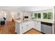 Bright kitchen featuring white cabinets, granite countertops, stainless appliances, and an island with sink at 4818 Terrace Green Trce, Stone Mountain, GA 30088