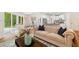 The living room offers an open layout to the dining and kitchen areas, perfect for modern living at 4818 Terrace Green Trce, Stone Mountain, GA 30088