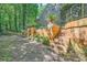 Multi-level backyard with stone walls, stairs, and beautiful landscaping features at 6520 Indian Acres Trl, Tucker, GA 30084