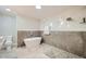 Modern bathroom featuring a freestanding tub, glass-enclosed shower, and elegant marble accents at 6520 Indian Acres Trl, Tucker, GA 30084