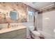 Vintage-style bathroom featuring floral wallpaper, a vanity with a pink marble countertop, and a classic tub at 6520 Indian Acres Trl, Tucker, GA 30084