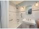 Classic white bathroom with a shower-tub combination and a pedestal sink at 6520 Indian Acres Trl, Tucker, GA 30084